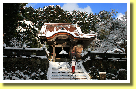 Pilgrim walking in snow, Meiseki Temple, Seiyo City, Ehime Pref., Shikoku